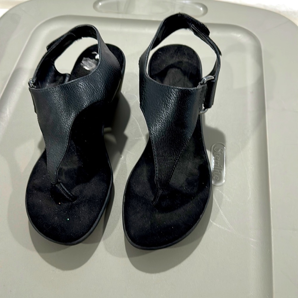 Black sandals.
